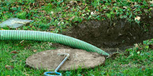 septic system cleaning in a residential backyard